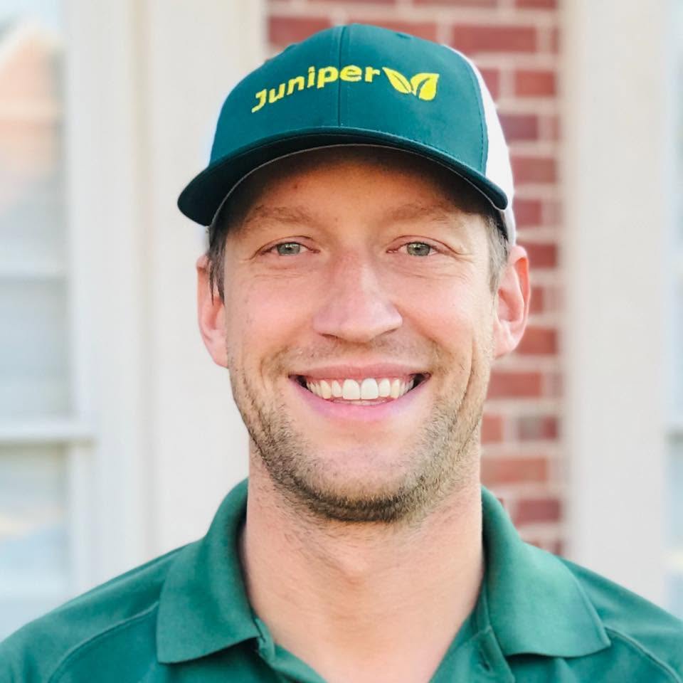 Mike, owner of Juniper Pinestraw, wearing a Juniper cap